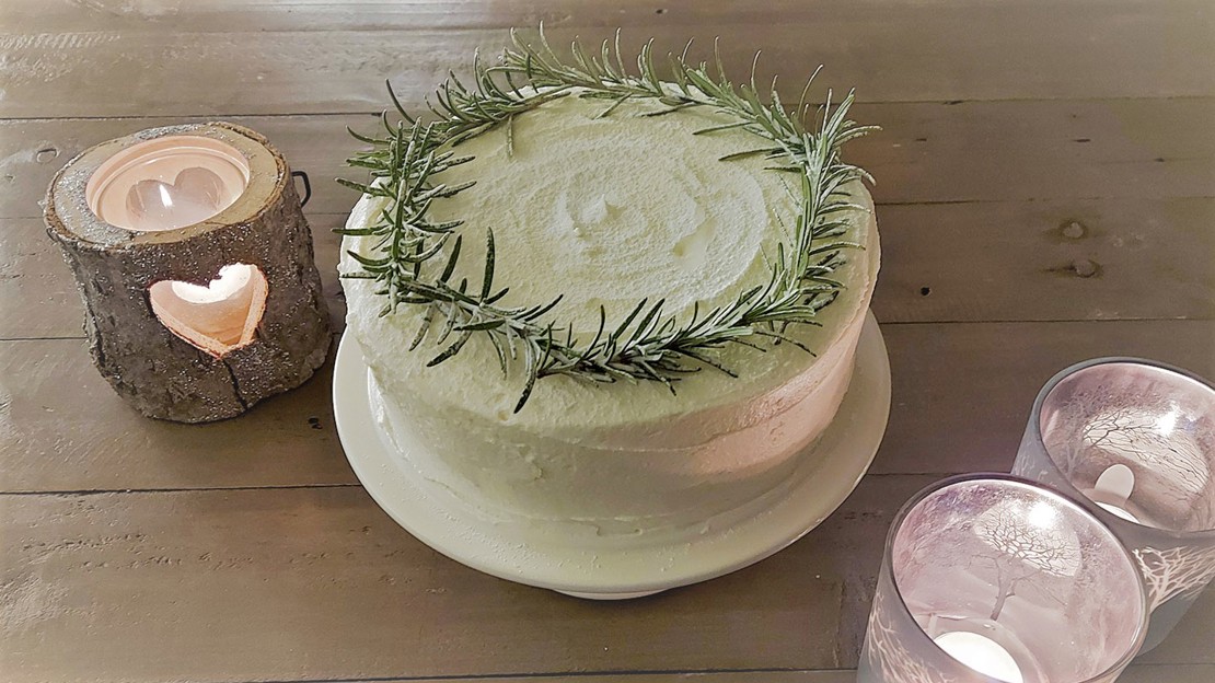 Natural Christmas cake decoration using rosemary