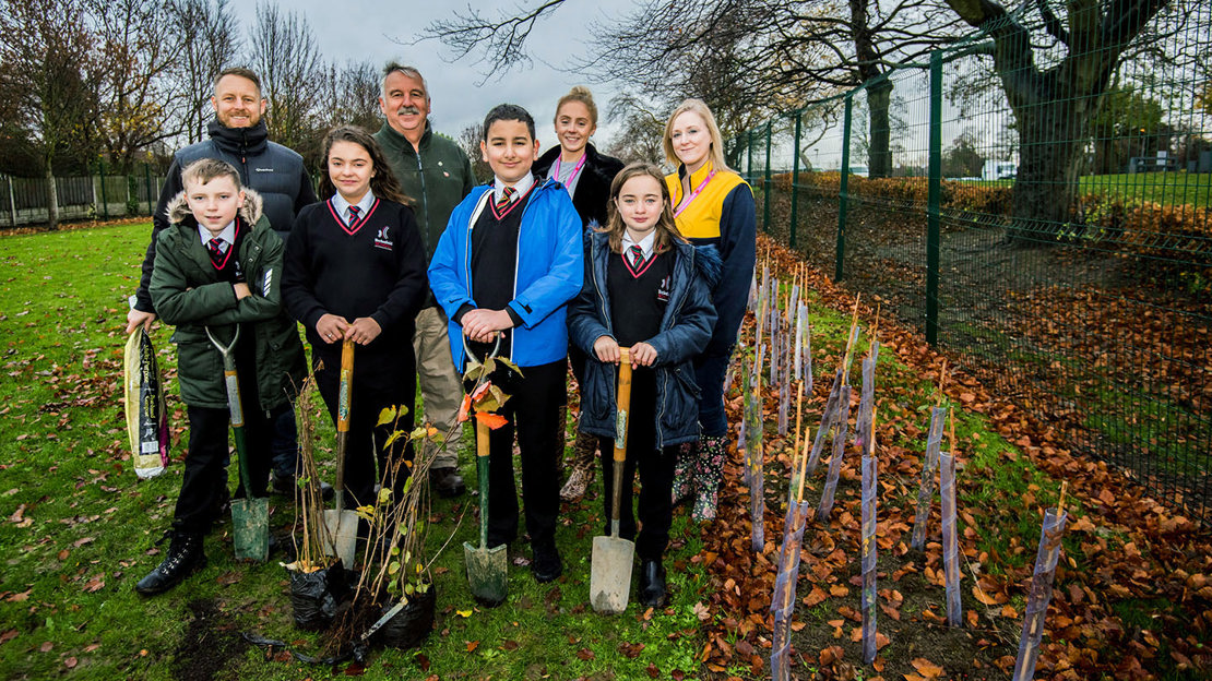Pupils from Ecclesfield School ready to plant trees in their school grounds