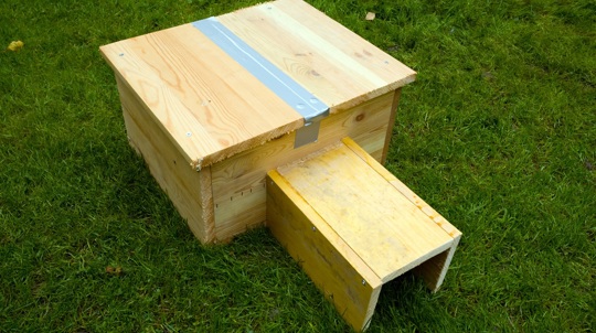 Homemade hedgehog house on grass