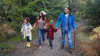 Family exploring a wood together