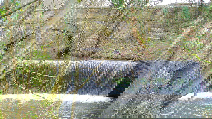 Weir with bridge in background