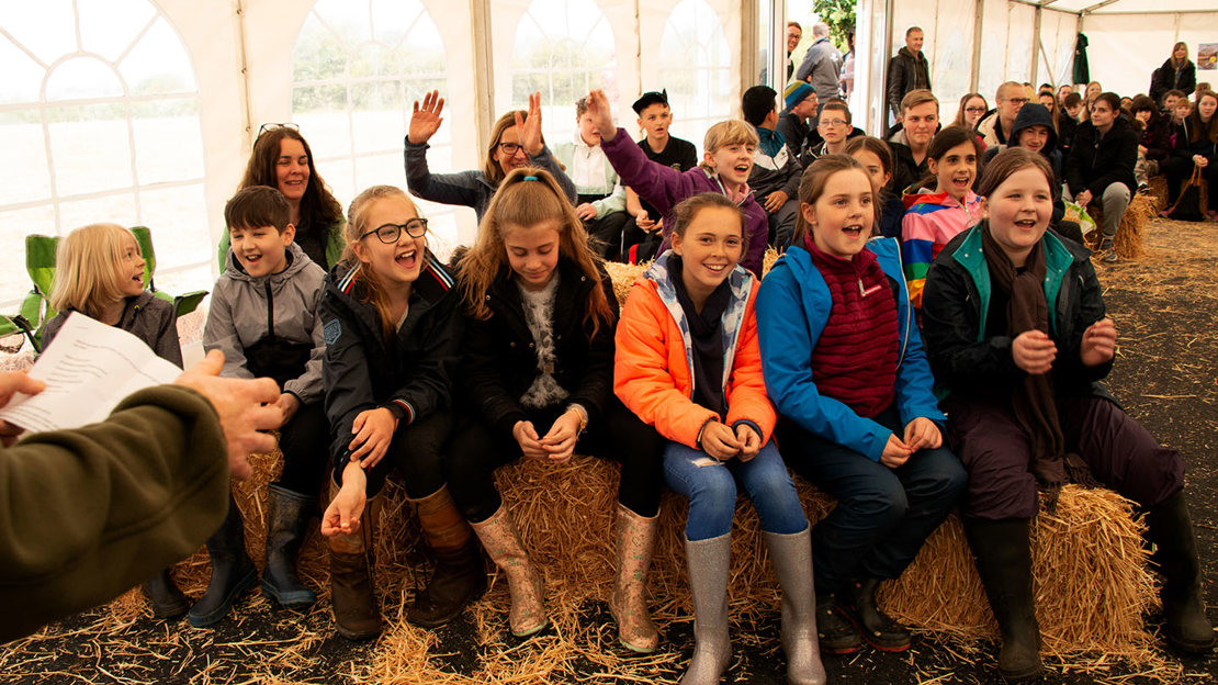 Children cheering, excited ready to plant trees at Mead.