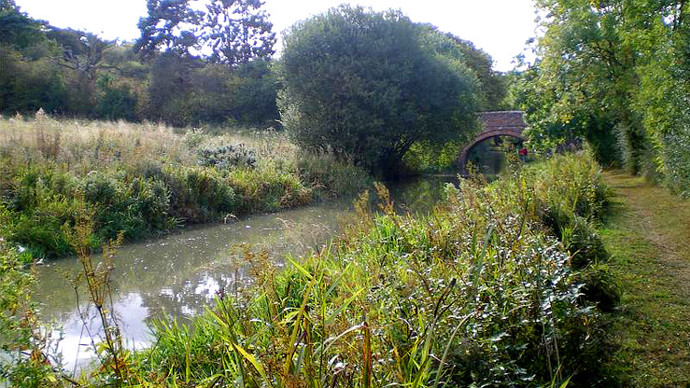 Grand Union Canal towpath, bridge in background