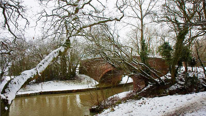 Snow covered Grand Union Canal bridge
