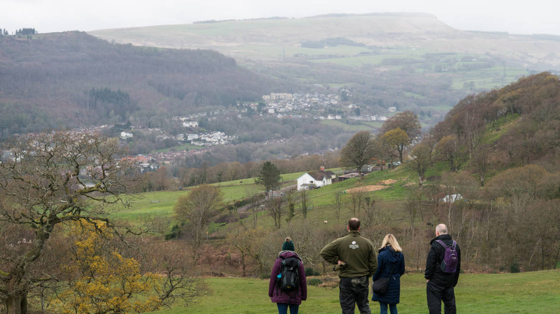 People enjoying the view over Neath from Brynau Farm