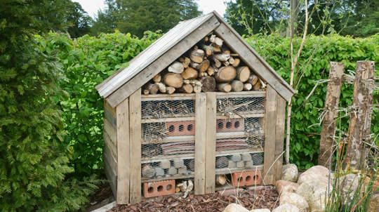 Bug hotel filled with bricks, stones and natural materials