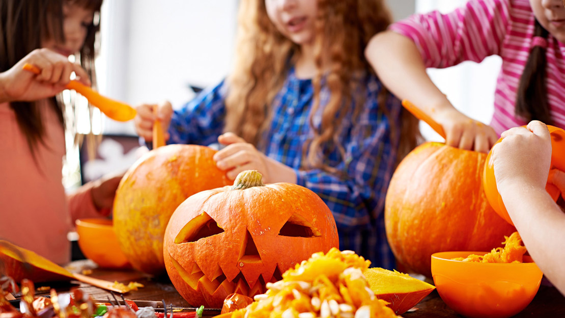 Children carving pumpkins