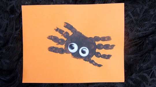 Spider handprint craft with googly eyes