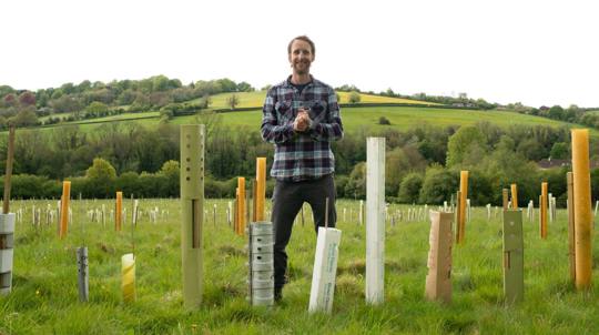 Site manager Joe Middleton with a range of plastic-free tree guard alternatives being trialed at Avoncliff Wood