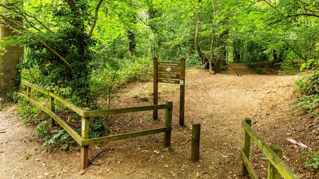 Welcome sign and path at Everdon Stubbs entrance