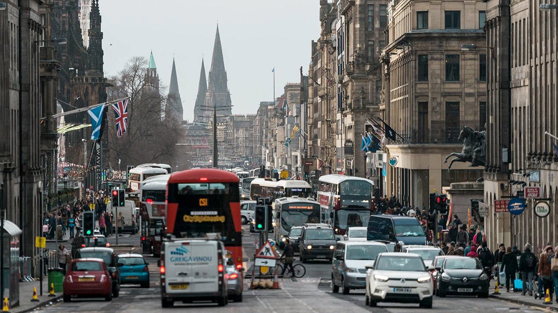 Congested traffic and pavements fill with pedestrians, princes street Edinburgh