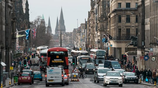 Congested traffic and pavements fill with pedestrians, princes street Edinburgh