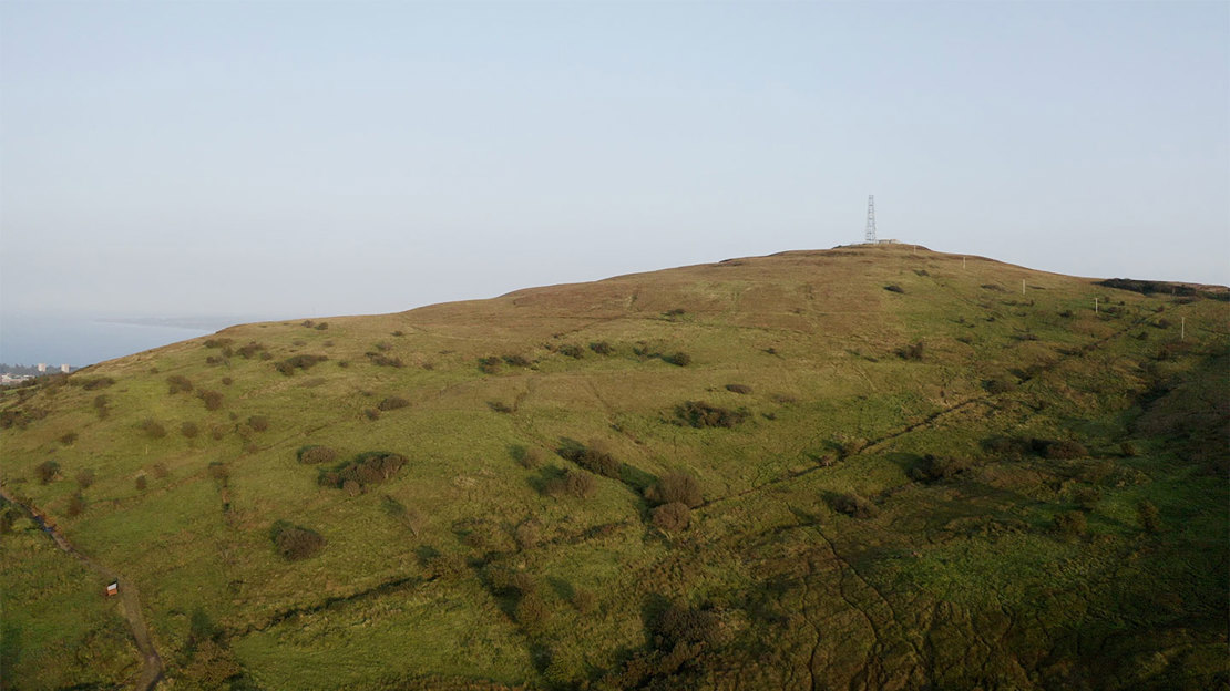 Communication mast on top of hill