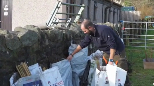 Philip Stallard with bags 0f saplings