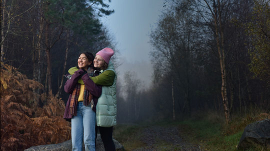 Young people hugging at Glen Finglas, autumn 2022