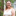 Head and shoulders shot of Woodland Trust trustee, Briony Nesbitt, with a background of tree branches