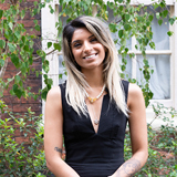 Head and shoulders shot of Woodland Trust trustee, Amber Thiara, with a background of tree branches Head and shoulders shot of Woodland Trust trustee, Amber Thiara, with a background of tree branches
