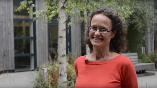 Volunteer Phillipa Batchelor outside Woodland Trust offices looking at the camera