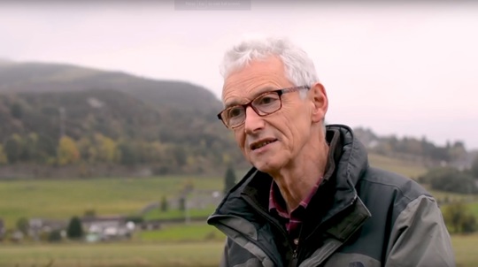 Volunteer Ian Baird in the countryside facing the camera