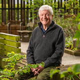 Head and shoulders shot of Lord Tony Hall against a backdrop of wood and leaves Head and shoulders shot of Lord Tony Hall against a backdrop of wood and leaves