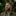 Luke Adam Hawker standing in front of a tree trunk