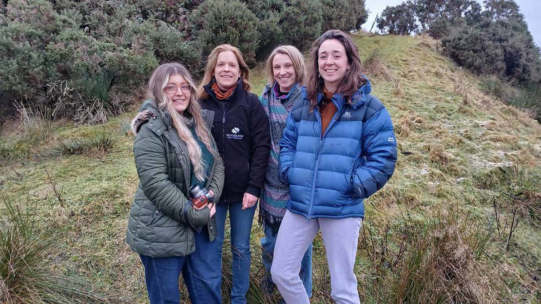 The Our Rainforest Futures project team posing for photograph in grassy countryside.